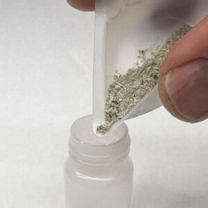 Pour the mushrooms into the plastic vial