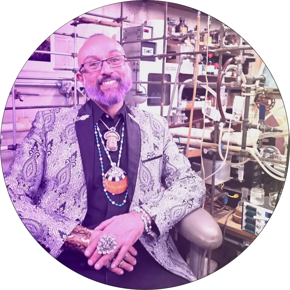 Mitchell Gomez, founder of the temple of harm reduction, seated in a laboratory.